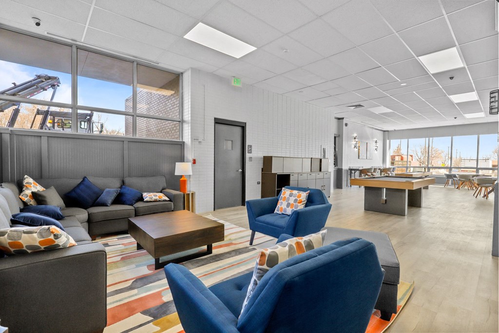 the lobby of a building with couches and chairs