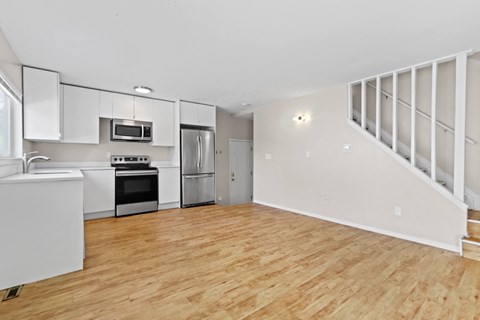 a kitchen and living room in a 555 waverly unit