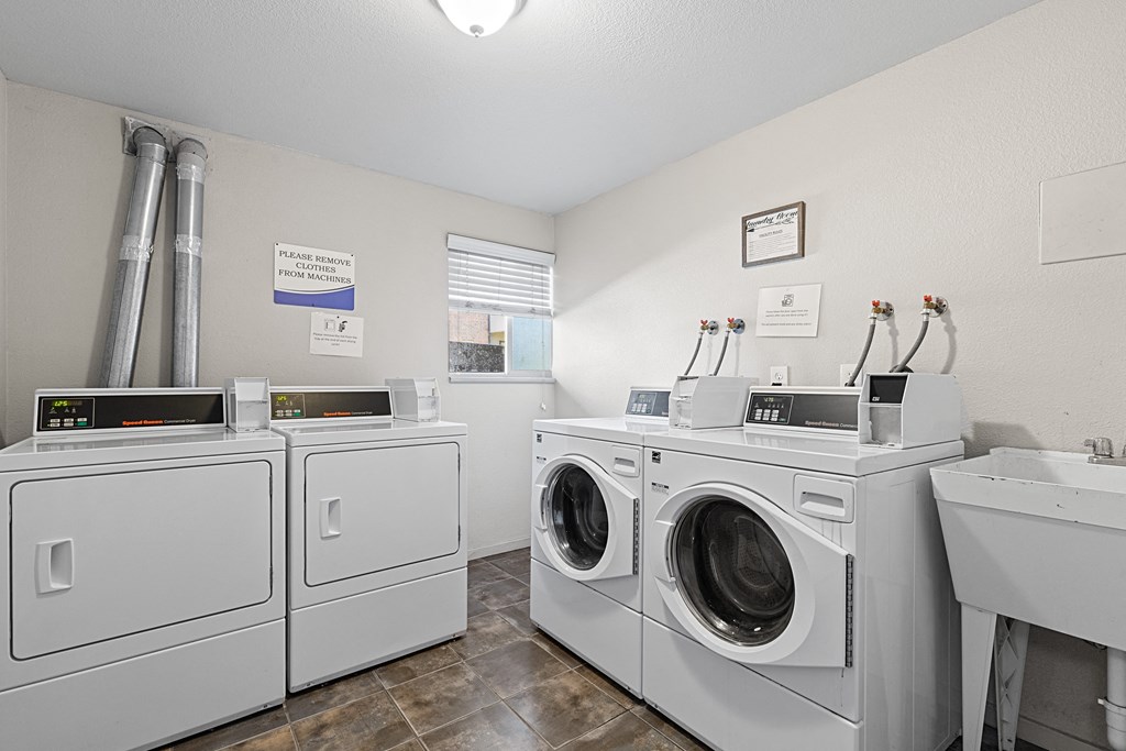 A row of washing machines in a laundromat.