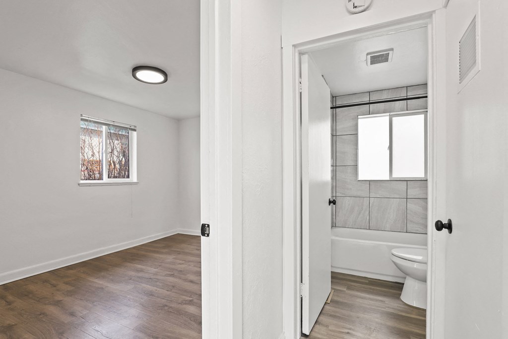 a renovated bathroom with a toilet and a shower in a renovated house