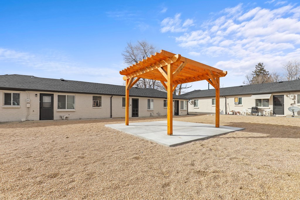 our yard has a swing set and a pavilion in front of our apartments