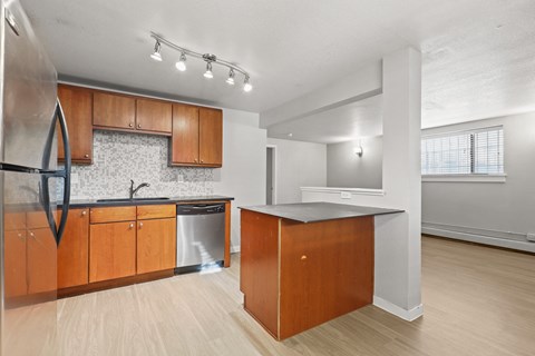 the preserve at ballantyne commons apartment kitchen with island and stainless steel appliances