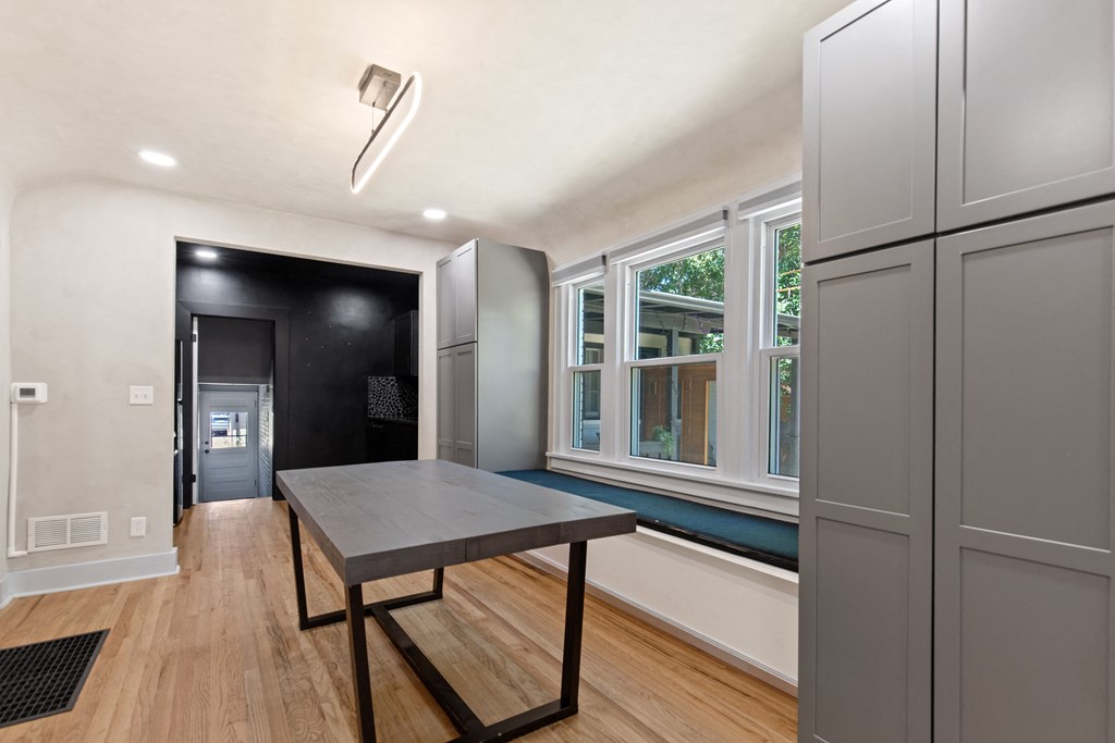 a view of a swimming pool with orange lights on the ceiling