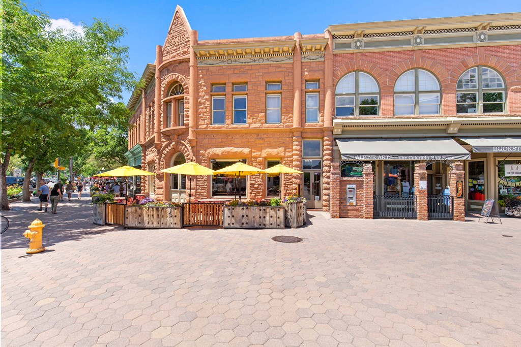 A street view of a building with a bakery on the ground floor.