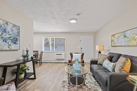 a living room with a couch and a glass coffee table