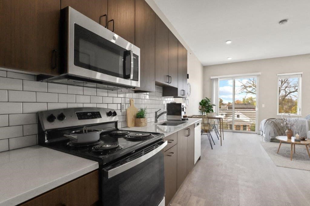 a kitchen with a stove and a microwave