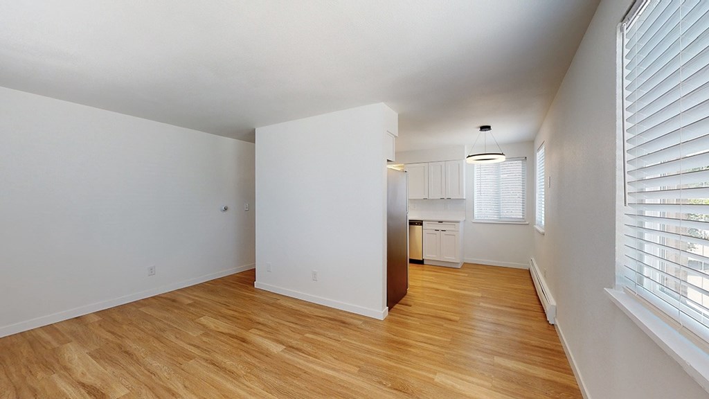 A room with wooden floors and white walls.