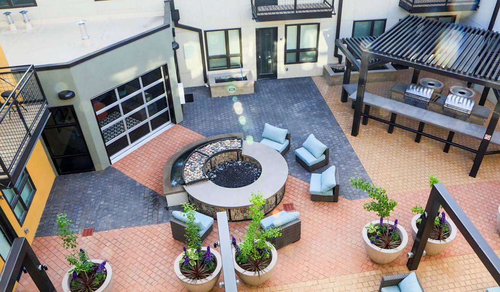 a view of the lobby of a hotel with a fire pit