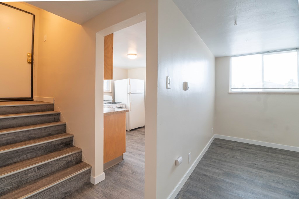 A room with a staircase leading to the upper floor.