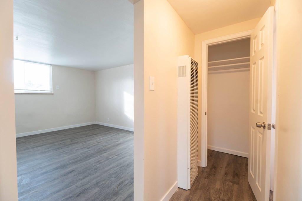 A room with a door and a window.