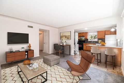 A living room with a brown chair and a coffee table.