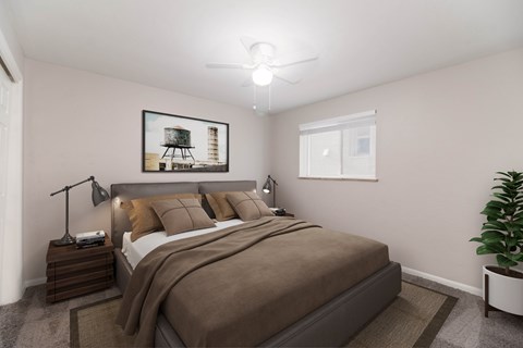 A bedroom with a bed, nightstand, and a picture on the wall.