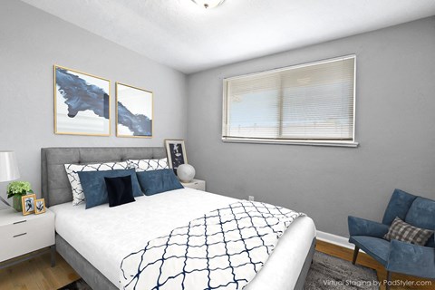 a bedroom with a large bed and a window