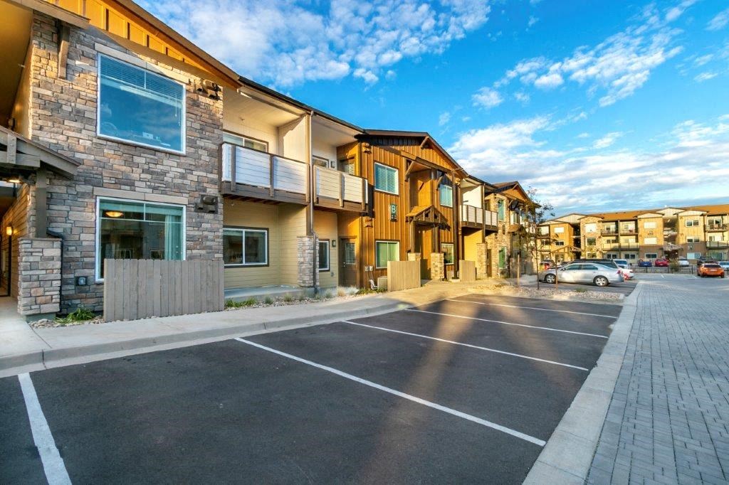 an empty parking lot in front of a building