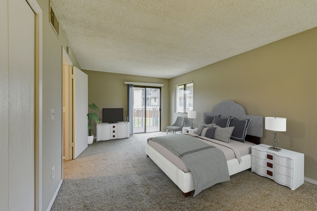 a master bedroom with a large bed and a large window