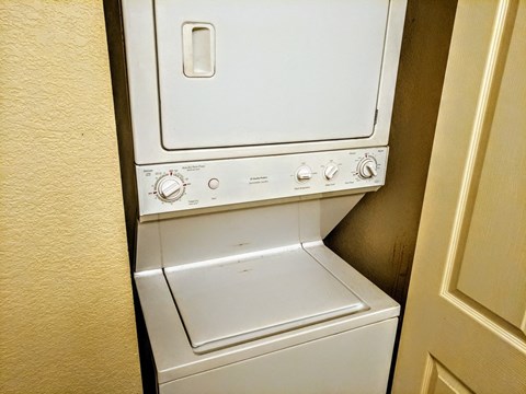 A white dishwasher is installed in a kitchen.