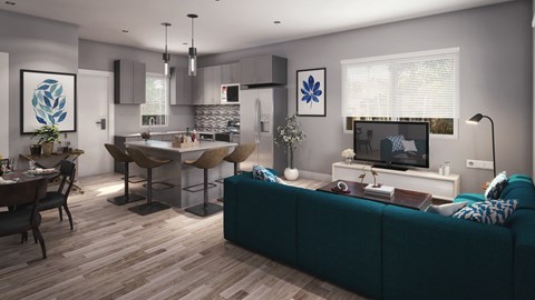 a living room and kitchen with a blue couch