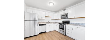 Kitchen with white cabinets and stainless steel appliances