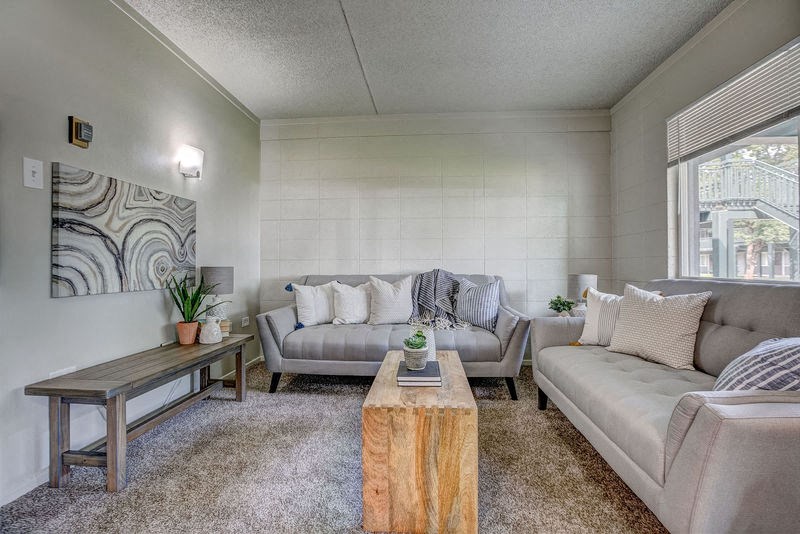 a living room with couches and a coffee table