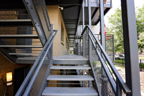 the stainless steel stairs to the exterior of a building