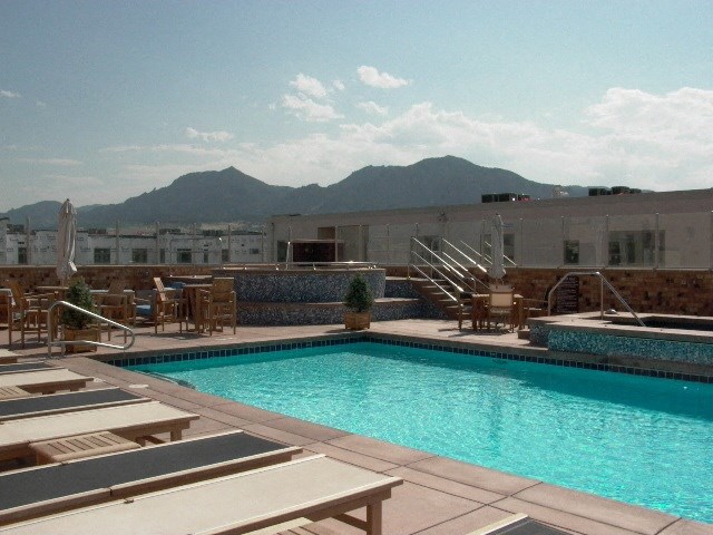 Rooftop pool with mountains in the background