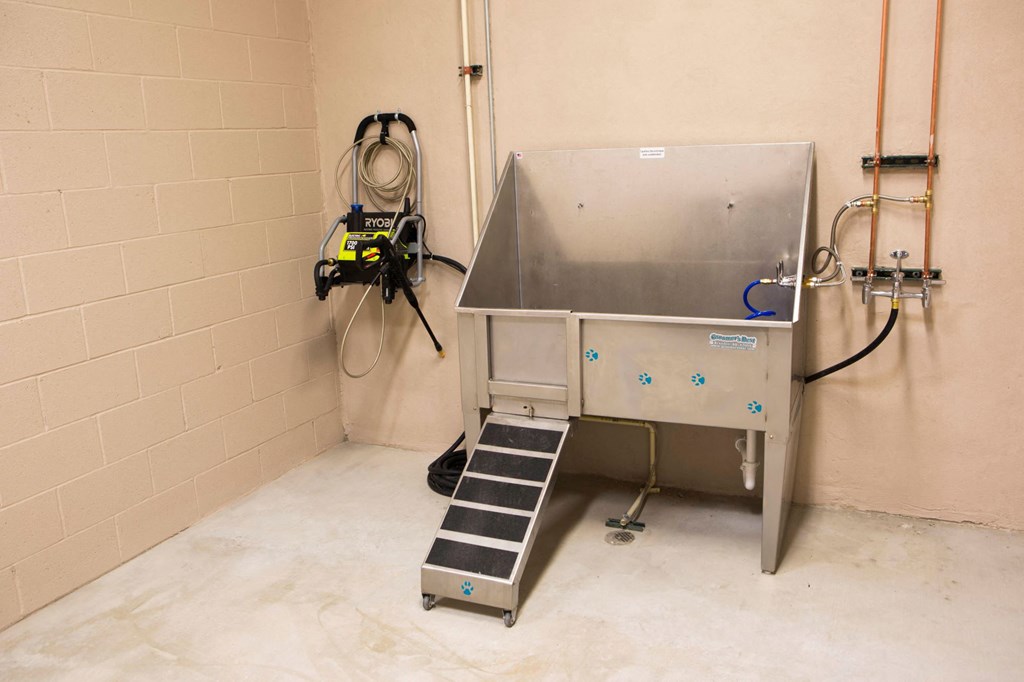 an empty room with a heater in the corner