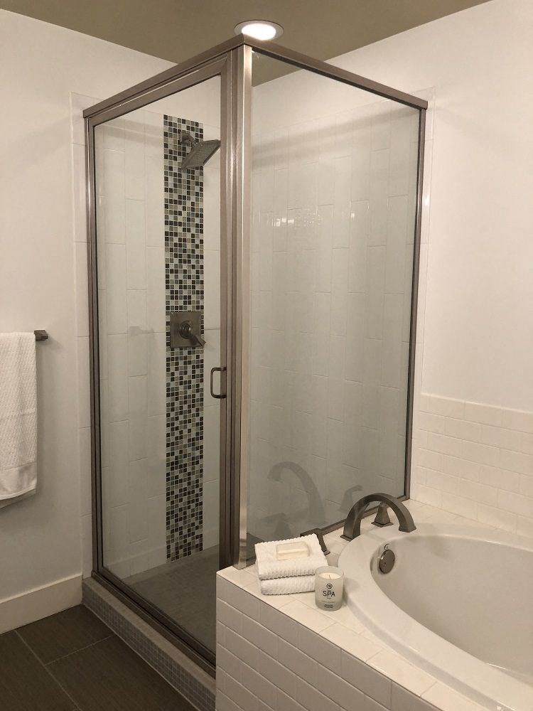 a bathroom with a shower and a bathtub