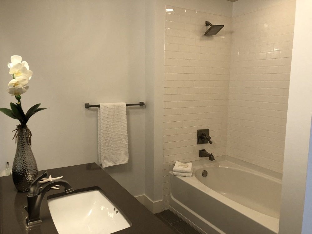 Another bathroom with a sink and a bathtub