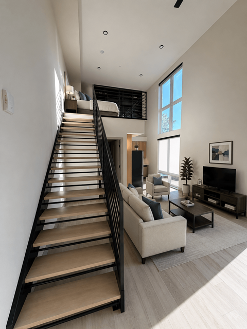 A living room with a staircase leading to the upper floor.