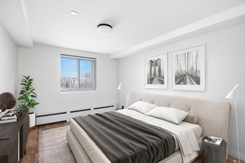 a bedroom with a large bed and a window