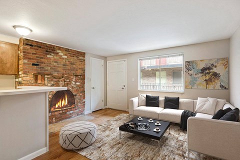 A living room with a fireplace and a couch.