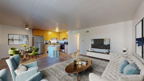 A modern living room with a blue sofa and a coffee table.