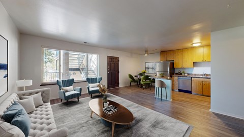 A modern living room with a white couch and blue chairs.