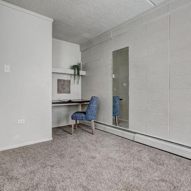 a room with a desk and a mirror