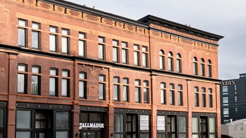 A red brick building with the name "Tallmadge" on the front.