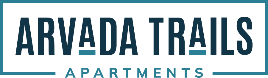 The image is a logo for Arvada Trails Apartments.