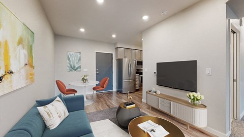 a living room with a blue couch and a tv