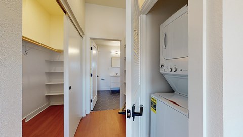 A white kitchen with a refrigerator, oven, and microwave.
