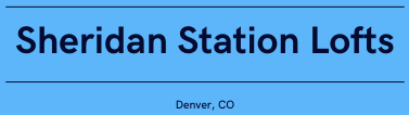 A blue sign with the words Sheridan Station Lofts in white.