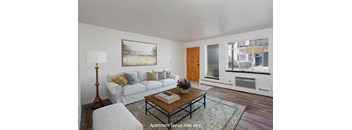 a living room with a white couch and a coffee table