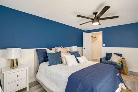 bedroom with a bed and a ceiling fan at The Iris Apartments, Colorado