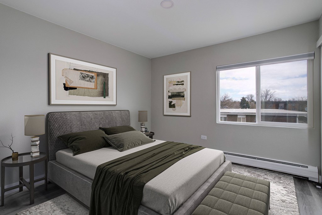 a bedroom with a bed and two windows