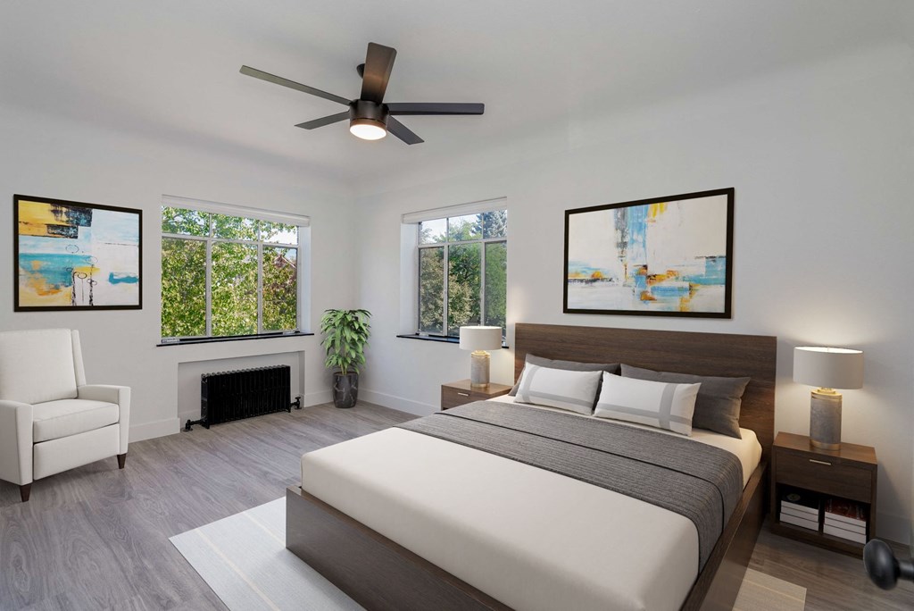 a bedroom with a bed and a ceiling fan