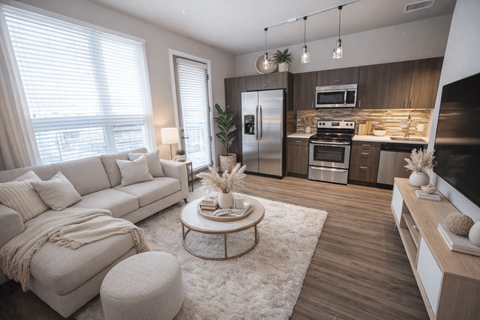 A modern living room with a white sofa and a coffee table.