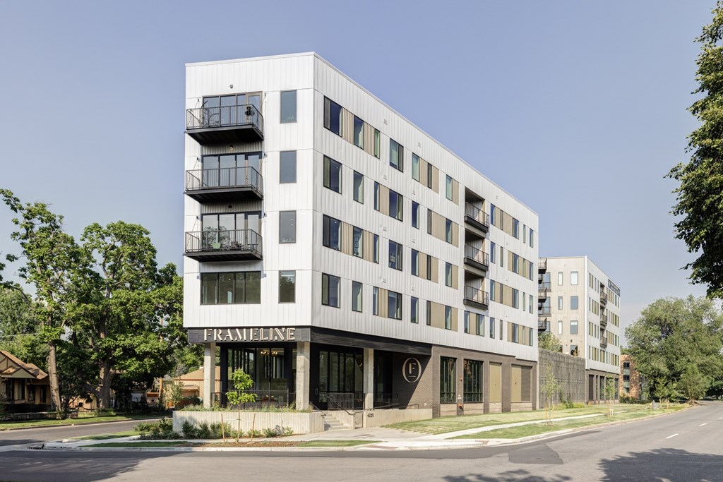 A modern apartment building with the name "FRANLINE" on the front.