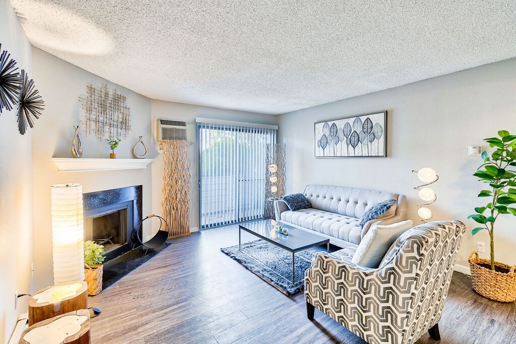Living Room With Fireplace at Miramar Apartments, Denver, CO 80231