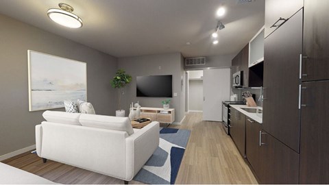 A modern living room with a white couch and a television.