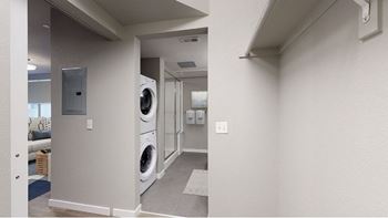 A laundry room with a washer and dryer.