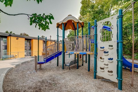 a playground with a slide and a swing set