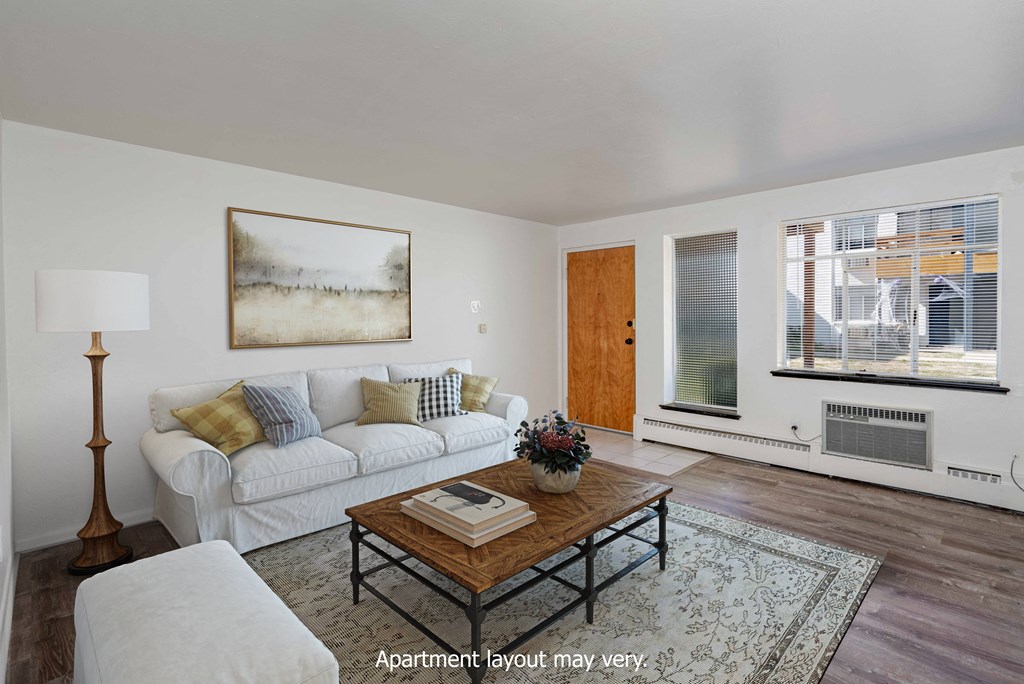 a living room with a white couch and a coffee table